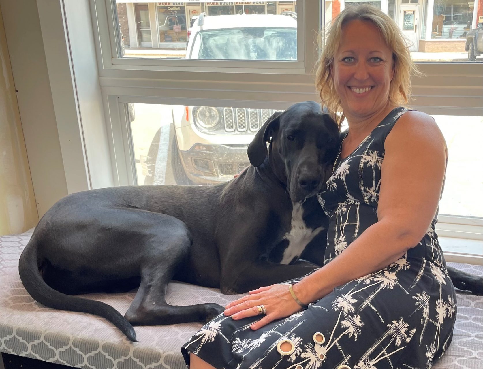 Photo of Lynda Johnson, Insurance Broker at heartland Insurance Services with her Great Dane Nui.